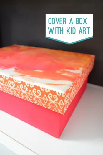 Decoupage d'una caixa amb art infantil