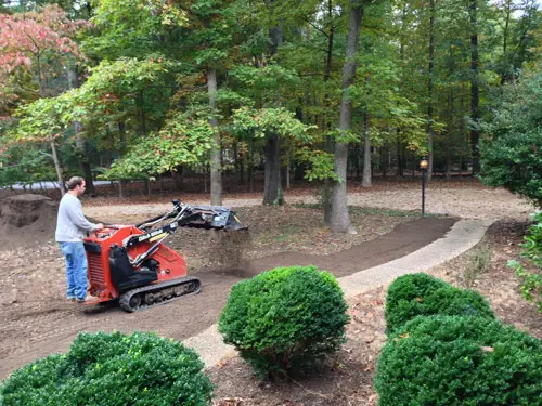 Yard Dirt Guy Spreading